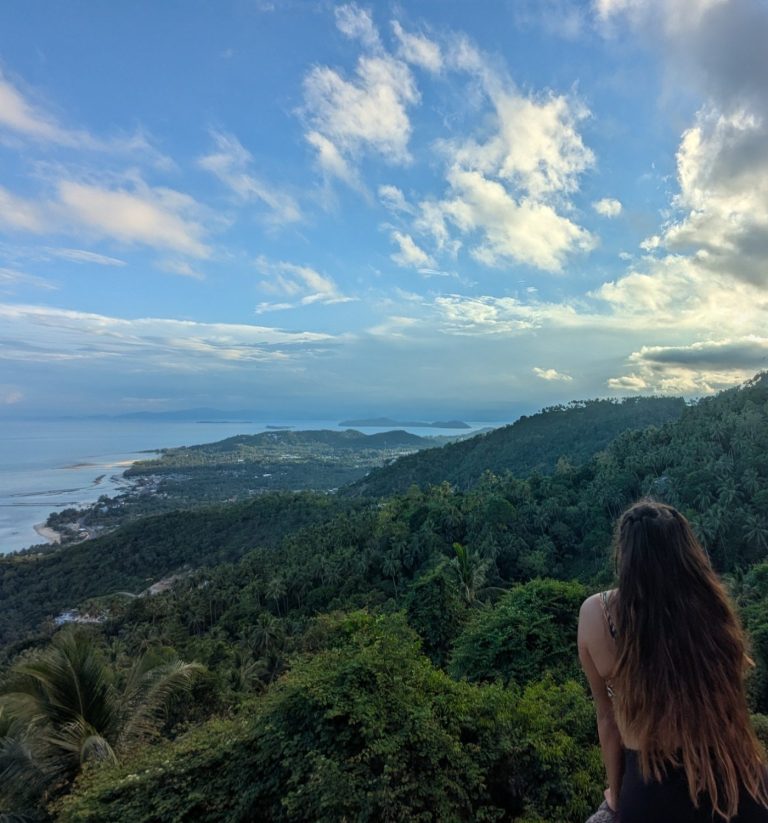 Charlotte, custom travel planner, looking out across the island toward the sea on Koh Samui, Thailand